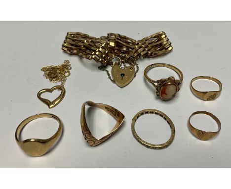 A 9ct gold gate bracelet; a 9ct gold signet ring; a 9ct gold cameo ring; a 9ct gold wishbone ring; a 9ct gold eternity ring; 