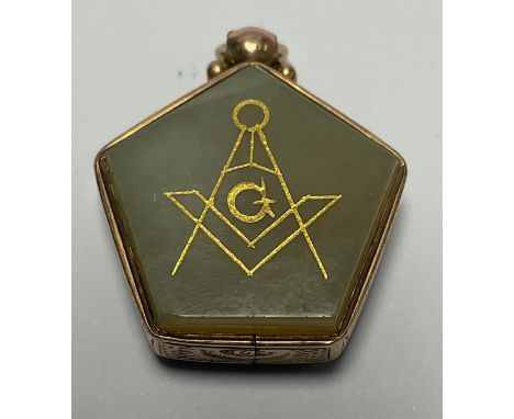 A late Victorian 9ct rose gold mounted pentagonal masonic bloodstone and quartz fob, engraved and gilded with a compass emble