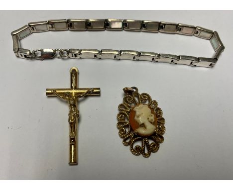 A 9ct gold mounted cameo pendant, 3.4g; a silver and mother-of-pearl bracelet; a gold plated crucifix pendant 