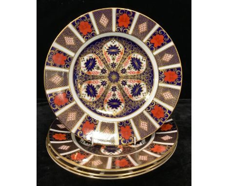 A set of four Royal Crown Derby 1128 pattern dinner plates, first quality, 27cm, printed marks 