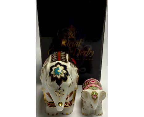 A Royal Crown Derby paperweight, Imari Elephant, trunk raised, gold stopper, boxed; another, Baby Indian Elephant, gold stopp