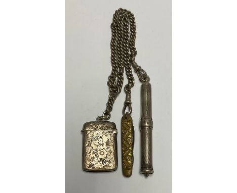 A late 19th century silver curb link graduated Albert chain, with Victorian silver vesta case, Birmingham 1897 and and Edward