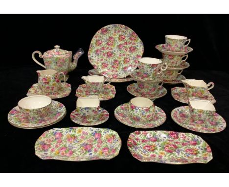 A Royal Grimwades Summertime pattern chintz associated part tea set, comprising teapot, milk jug and sugar bowl, two sets of 