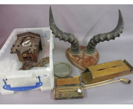 Pair of cattle horns mounted as a wall trophy, small reproduction cuckoo clock and sundries