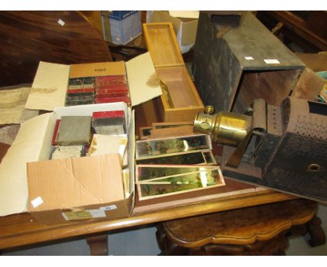 Collection of magic lantern slides together with a magic lantern in a wooden case