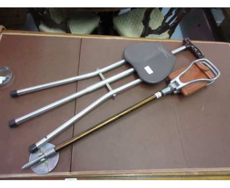 Featherweight English shooting stick with leather seat together with another tripod shooting stick