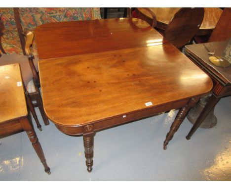 George IV mahogany D-end dining table, the reeded top with plain frieze raised on ring turned tapering supports having brass 