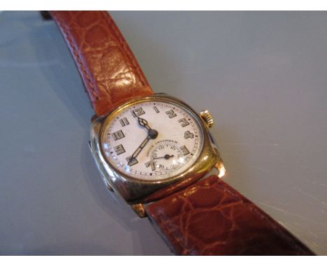 9ct Gold cushion cased wristwatch, the circular dial with Arabic numerals and subsidiary seconds with an Opex movement on a t