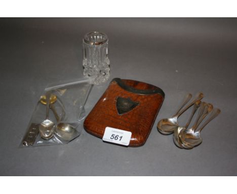 Silver mounted leather cigar case, a small antique silver sauce ladle, six teaspoons, ingot and other spoons together with a 