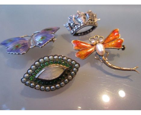 Two silver and enamel insect brooches, silver coronet brooch and a small oval mother of pearl inset brooch                   