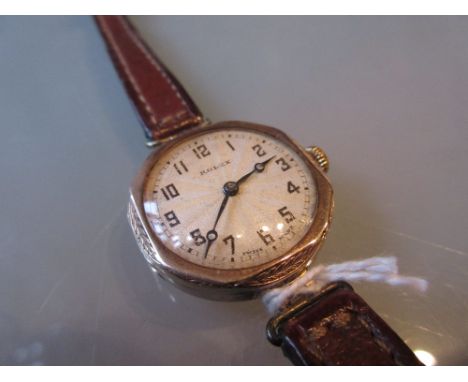 Ladies 9ct gold cased Rolex wristwatch having circular silvered engine turned dial with Arabic numerals and leather straps
