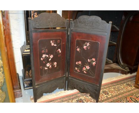 Japanese lacquer two panel table screen together with a Victorian carved circular footstool on three shaped supports