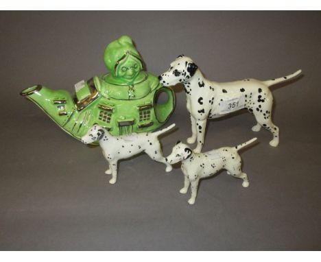 Group of three Beswick figures of dalmatians together with a Lingard 1930's pottery teapot ' The Old Lady Who Lived in a Shoe