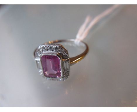 18ct White gold pink sapphire cluster ring with brilliant and baguette cut diamond surround