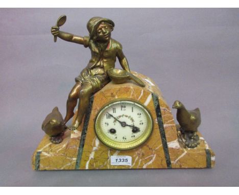 Art Deco yellow marble and gilt metal mounted two train mantel clock surmounted by a figure of a boy feeding geese