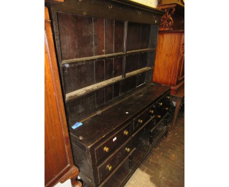 Late 19th Century oak dresser, the two shelf back above an arrangement of five drawers with pot shelf, raised on turned suppo