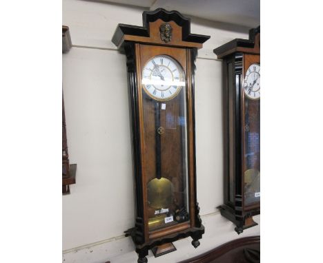 Victorian walnut and ebonised Vienna wall clock, the enamel dial with Roman numerals and subsidiary seconds with a single tra