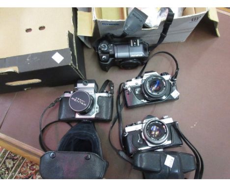 Asahi Pentax 35mm camera together with two Olympus cameras OM1 and OM10 and an Olympus E300 camera body