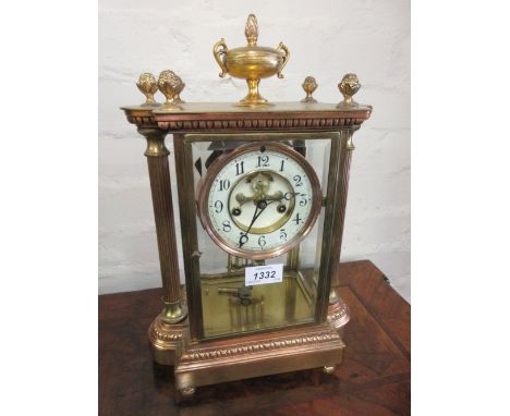 Late 19th or early 20th Century gilt brass four glass library clock with enamel dial, Arabic numerals, visible escapement and
