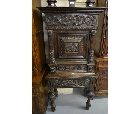 Small good quality 19th Century Flemish carved oak cabinet on stand decorated in high relief with a central panel depicting a