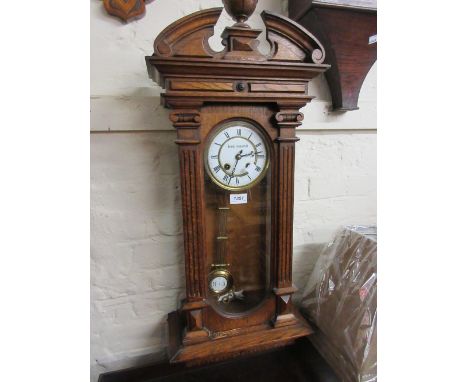 Oak cased Vienna wall clock, the enamel dial with Roman numerals and two train movement striking on a gong