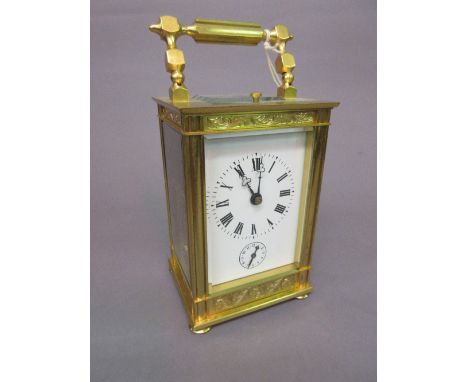 Large 20th Century gilt brass cased carriage clock, the enamel dial with Roman numerals and subsidiary alarm dial, the two tr