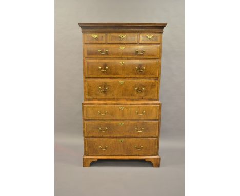 18th Century walnut tallboy, the moulded cornice above three short and six long graduated drawers with herringbone line inlay