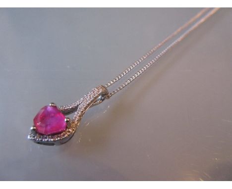 18ct White gold ruby and diamond pendant on a silver chain