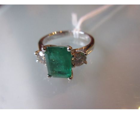 18ct White gold emerald and diamond ring, the emerald approximately 2.3ct, the diamonds approximately 0.63ct total