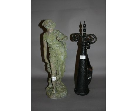Spelter figure of a classical maiden (at fault) together with a wrought iron torch bracket