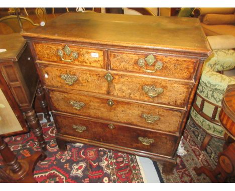18th Century burr elm and oak straight front chest of two short and three long graduated drawers with brass handles and escut