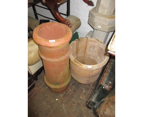 Terracotta chimney pot together with a terracotta garden planter