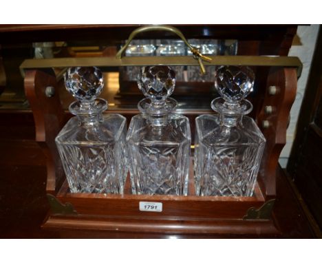 Good quality reproduction mahogany brass mounted three decanter tantalus
