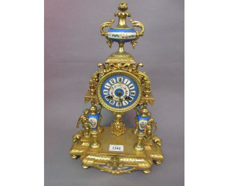 19th Century French gilded spelter and porcelain mounted portico type clock, the ornate case with an urn surmount and drum fo