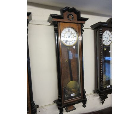 Vienna walnut and ebonised wall clock, the enamel dial with Roman numerals and subsidiary seconds with a two train weight dri