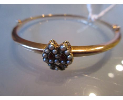 15ct Gold bangle mounted with a pearl set intertwined heart
