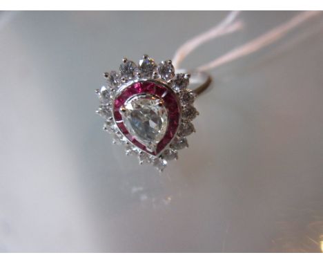 18ct White gold pear shaped diamond and ruby cluster ring, the diamond approximately 0.57ct