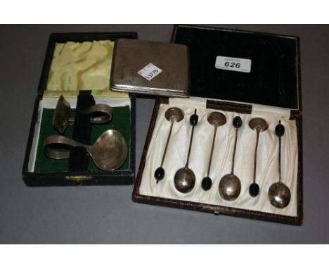 Cased set of six silver bean handled coffee spoons, a silver cigarette case and a cased silver spoon with pusher