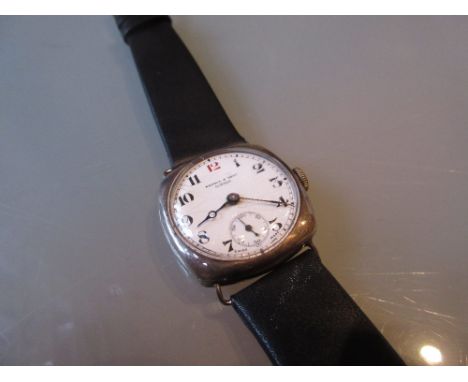 Silver cushion cased wristwatch by Kendal and Dent