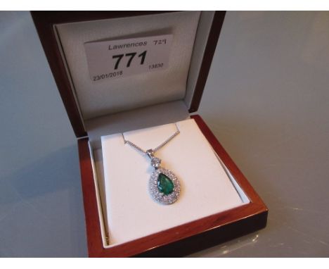 18ct White gold pear shaped emerald and diamond pendant on an 18ct white gold chain, the emerald approximately 1.25ct