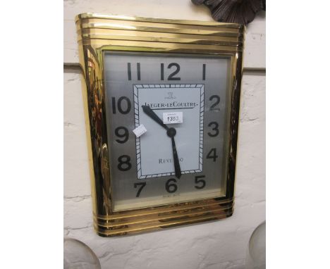 Large Jaeger LeCoultre Reverso Collection gilt metal cased wall clock with silvered dial and Arabic numerals, 16ins x 13ins
