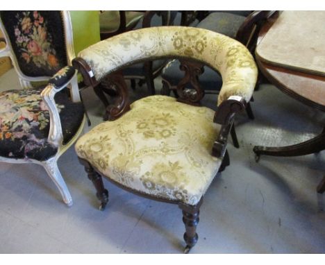 19th Century mahogany tub shaped office chair, having C-scroll carved decoration raised on turned tapering front supports wit