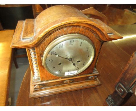Oak cased mantel clock having circular silvered dial with two train movement