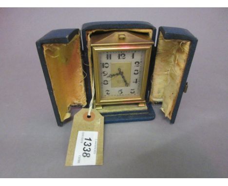 Small gilt brass cased travelling clock by Zenith, circa 1930, the silvered dial with Arabic numerals, the fixed key wind mov