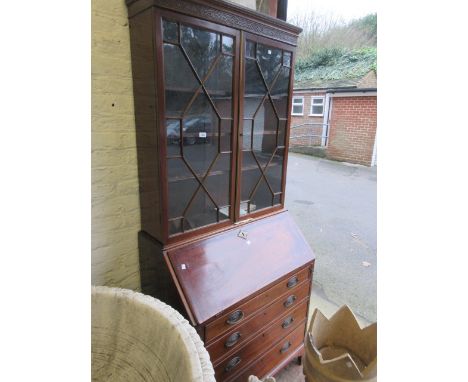 George III mahogany bureau bookcase with a moulded cornice above two astragal glazed doors, the base with a fall front enclos