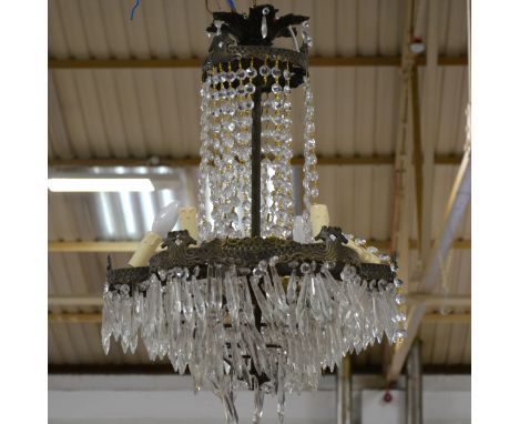 A metal framed multi-light chandelier, with glass festooning and pendants, lobed design incorporating tantel fitments, 22cm d