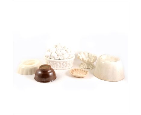 Several ceramic jelly/ blancmange moulds and others.