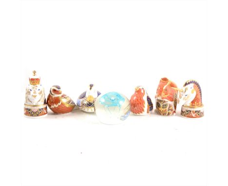Four Royal Crown Derby paperweights, all gold buttons, pair of Worcester Lion and Unicorn candle snuffers, boxed with certifi