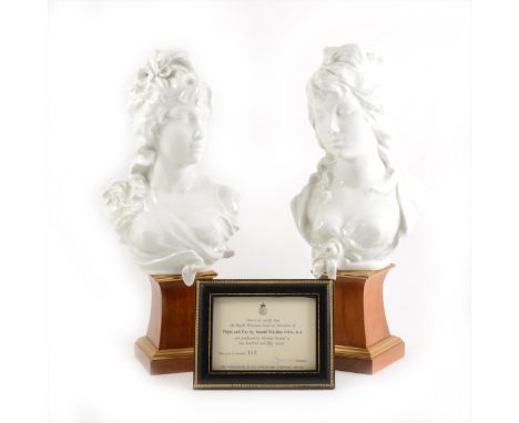 A pair of Royal Worcester glazed busts modelled by Arnold Machin O.B.E ., R.A . "Night and Day.", the busts mounted on wooden