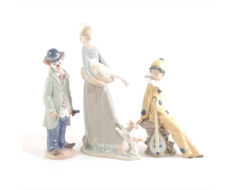 A Lladro figure of a clown and violin, 22cm, a Nao figure of a girl with a goose and puppy, 28cm, a Nao Pierrot seated figure